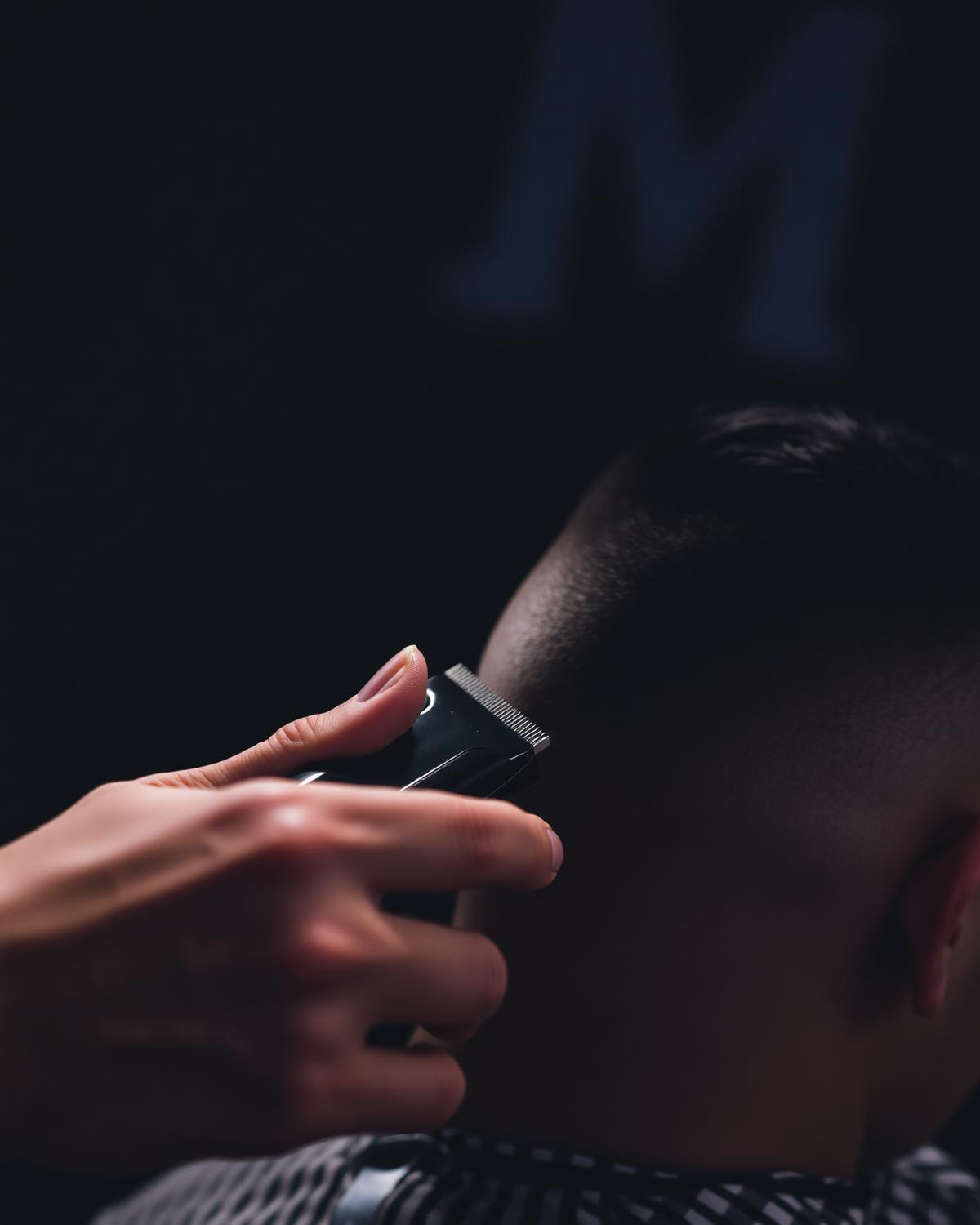 Precision clipper work during a student practical at Sean's Barber School